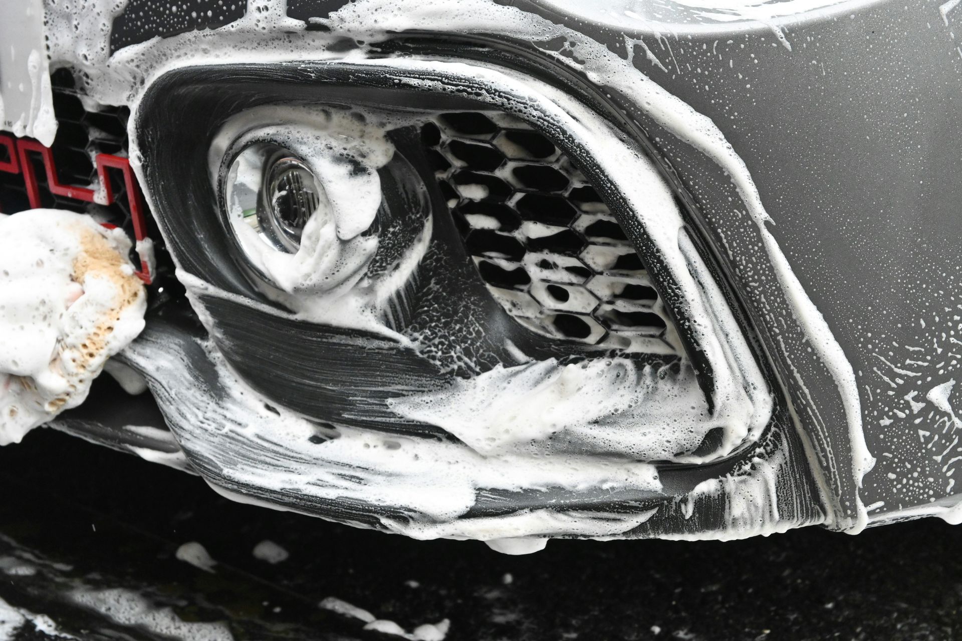 a close up of a car with snow on it